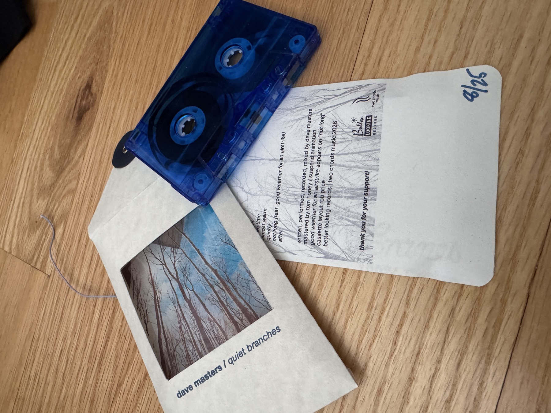 card insert with tracklist and credits, hand-numbered 8 of 25
