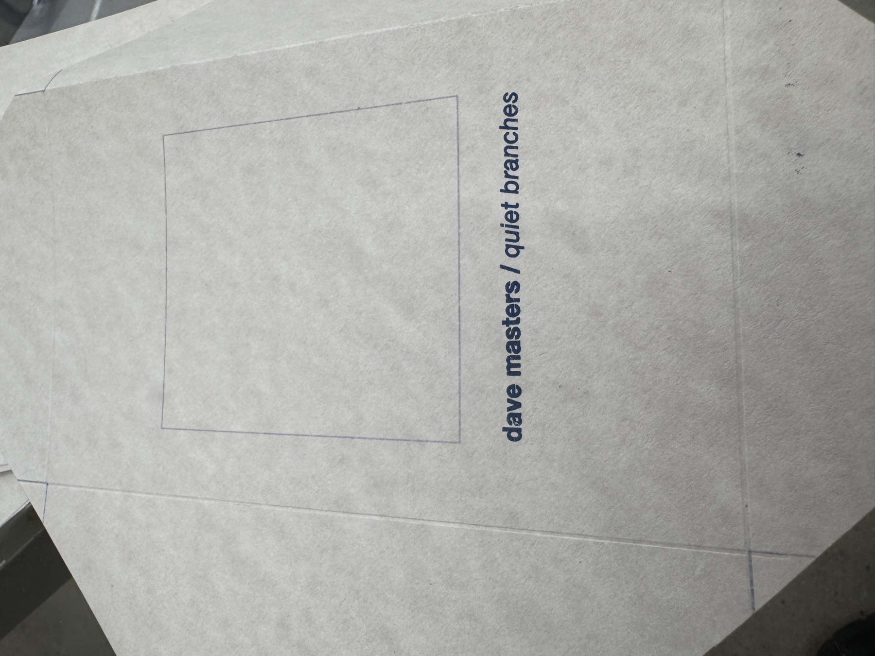 a flat glassine sleeve before folding, window scored and cover printed