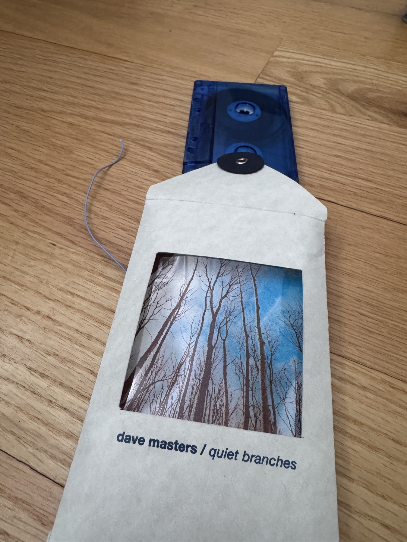 blue translucent cassette sliding out of the sleeve